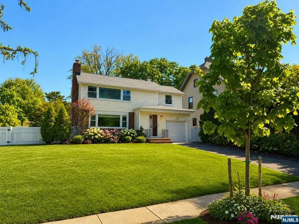 a view of a house with a yard porch and sitting area