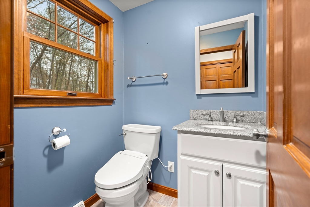 91 Century Way Dunstable, MA 01827 - Photo 14 of 31 a bathroom with a toilet sink vanity and mirror