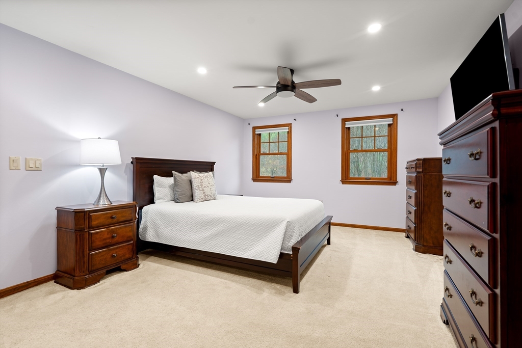 91 Century Way Dunstable, MA 01827 - Photo 16 of 31 a bedroom with a bed flat screen tv and window