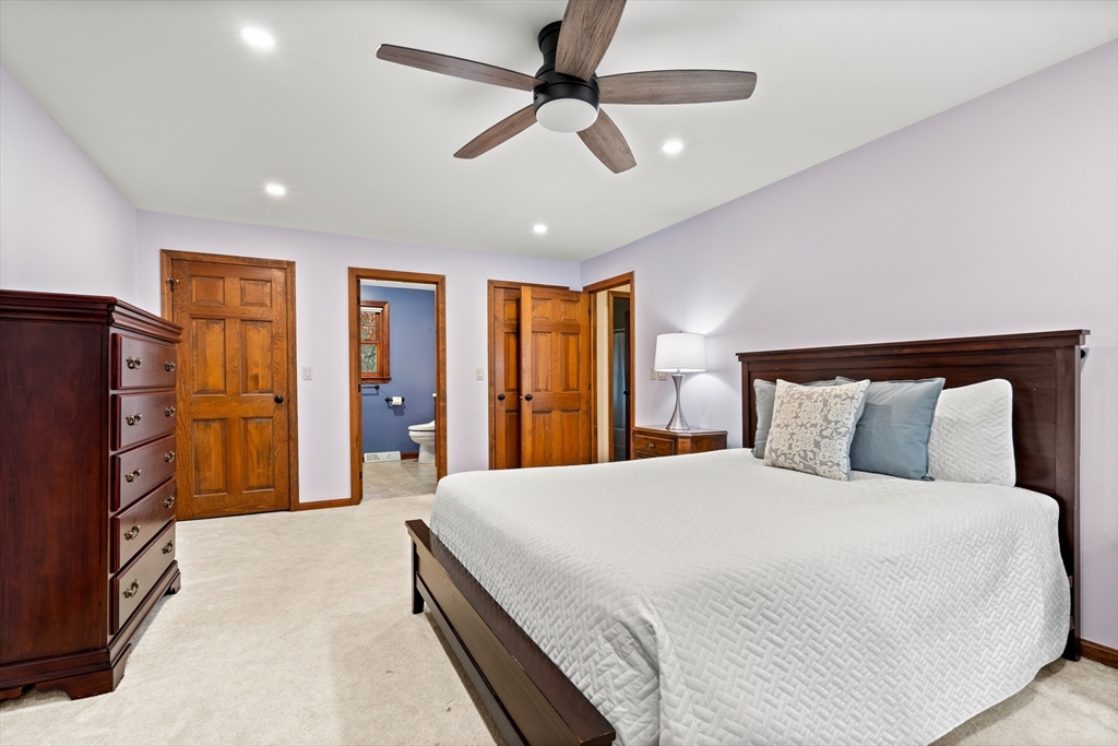 91 Century Way Dunstable, MA 01827 - Photo 17 of 31 a bedroom with a large bed closet and flat tv