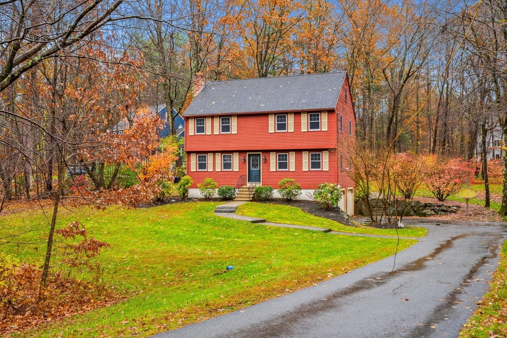 91 Century Way Dunstable, MA 01827 - Photo 31 of 31 a front view of a house with yard and green space