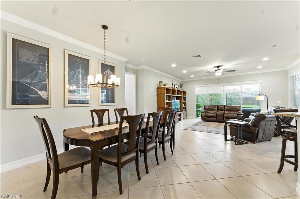 6899 Del Mar Terrace Naples, FL 34105 - Photo 14 of 41 a view of a dining room with furniture