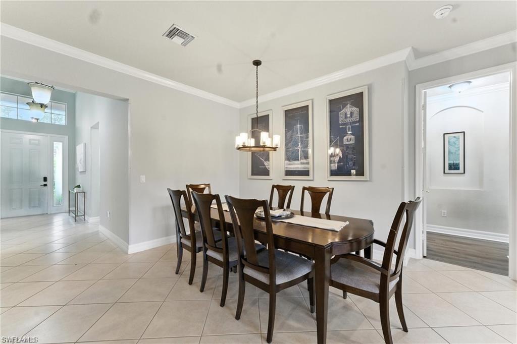 6899 Del Mar Terrace Naples, FL 34105 - Photo 15 of 41 a view of a dining room with furniture