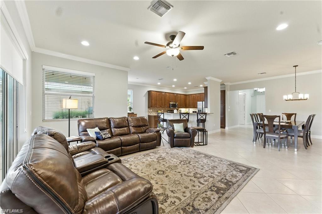 6899 Del Mar Terrace Naples, FL 34105 - Photo 16 of 41 a living room with furniture and a view of kitchen