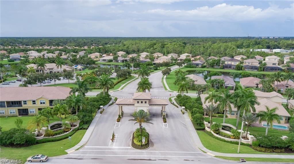 6899 Del Mar Terrace Naples, FL 34105 - Photo 2 of 41 an aerial view of a house with a garden