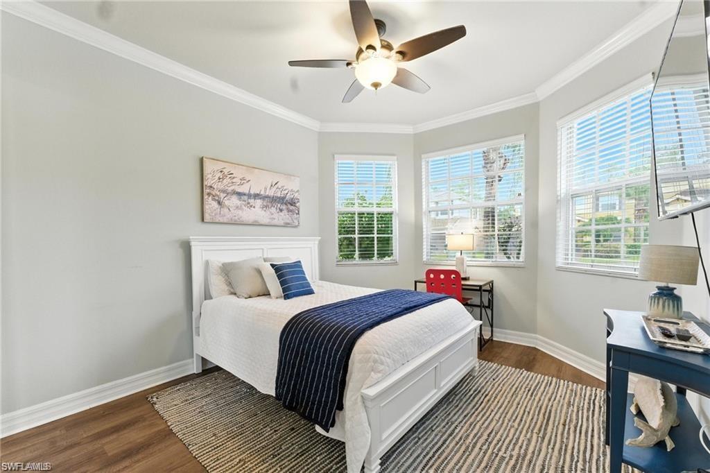 6899 Del Mar Terrace Naples, FL 34105 - Photo 23 of 41 a bedroom with a large bed and a window