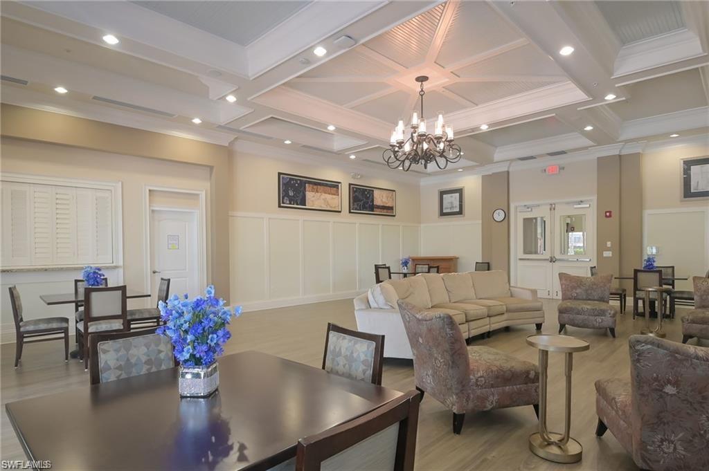 6899 Del Mar Terrace Naples, FL 34105 - Photo 39 of 41 a view of a dining room with furniture and chandelier