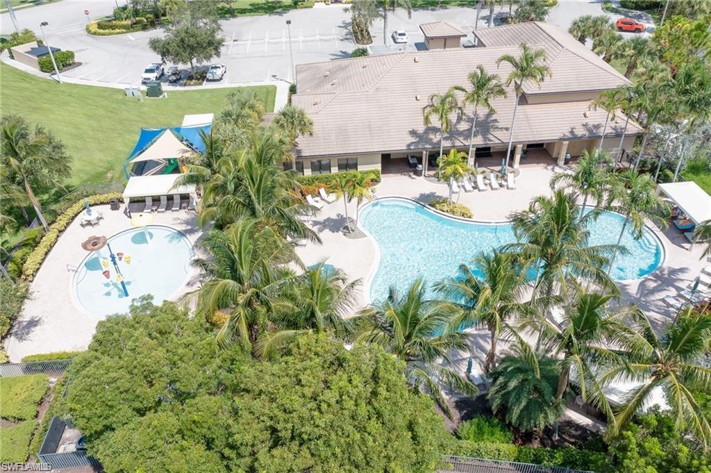 6899 Del Mar Terrace Naples, FL 34105 - Photo 9 of 41 an aerial view of a house with a yard and lake view