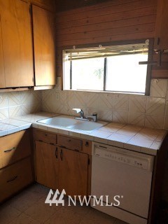 793 Rhoades Road Winlock, WA 98596 - Photo 23 of 24 a kitchen with a sink and a window