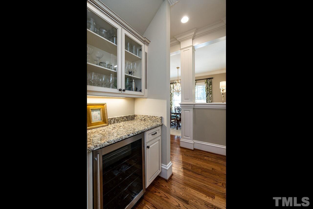 3024 Farrior Road Raleigh, NC 27607 - Photo 17 of 42 a kitchen with granite countertop white cabinets and appliances
