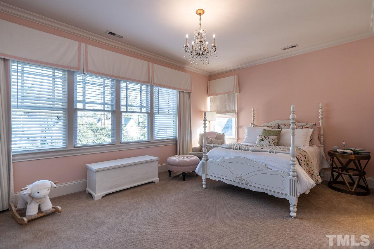 3024 Farrior Road Raleigh, NC 27607 - Photo 28 of 42 a bedroom with bed and a large window