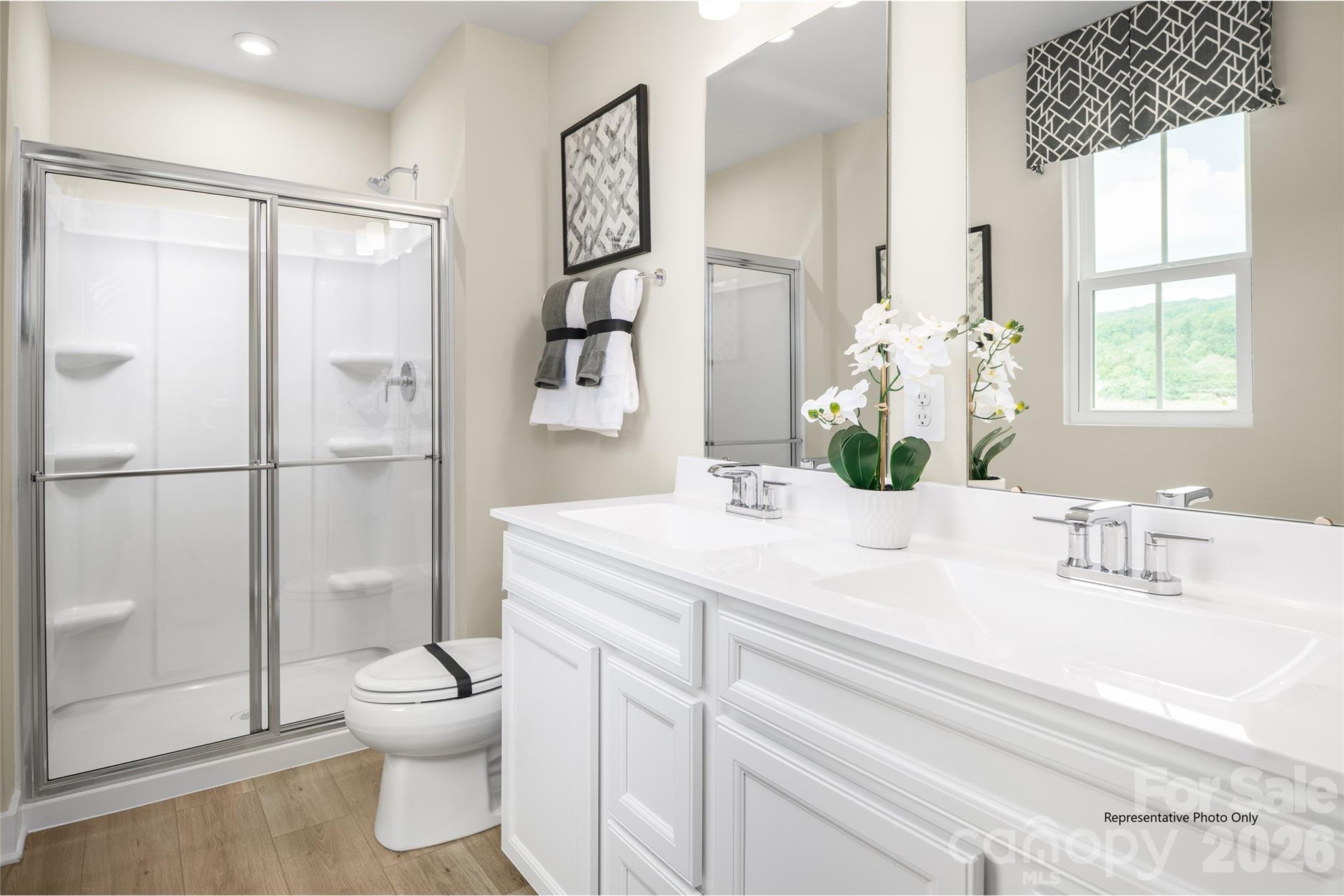 1020 Bracken Hill Road Indian Trail, NC 28079 - Photo 15 of 28 a bathroom with a sink toilet and shower