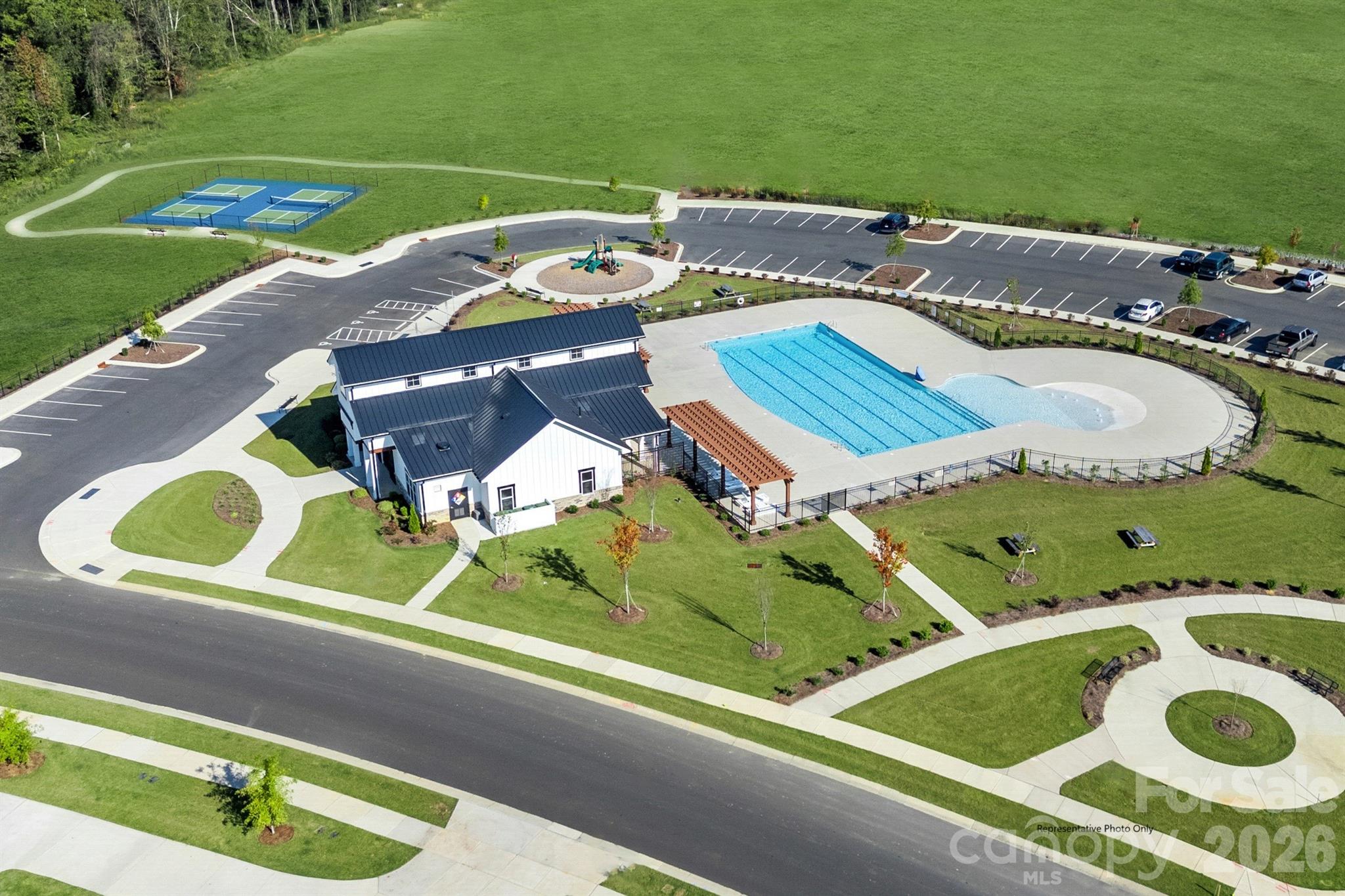 1020 Bracken Hill Road Indian Trail, NC 28079 - Photo 21 of 28 an aerial view of a house with a garden and lake view