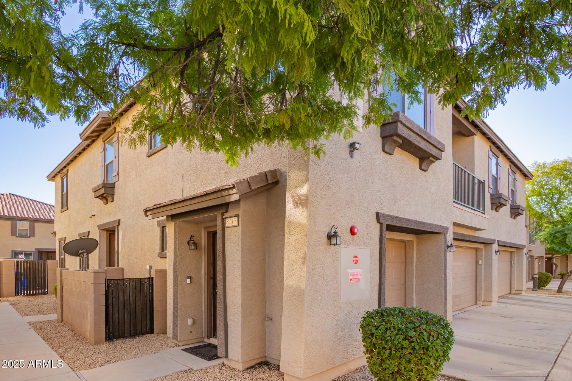 8117 West Groom Creek Road Phoenix, AZ 85043 - Photo 17 of 33 a front view of a house with garden