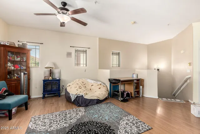 a bedroom with furniture and a mirror