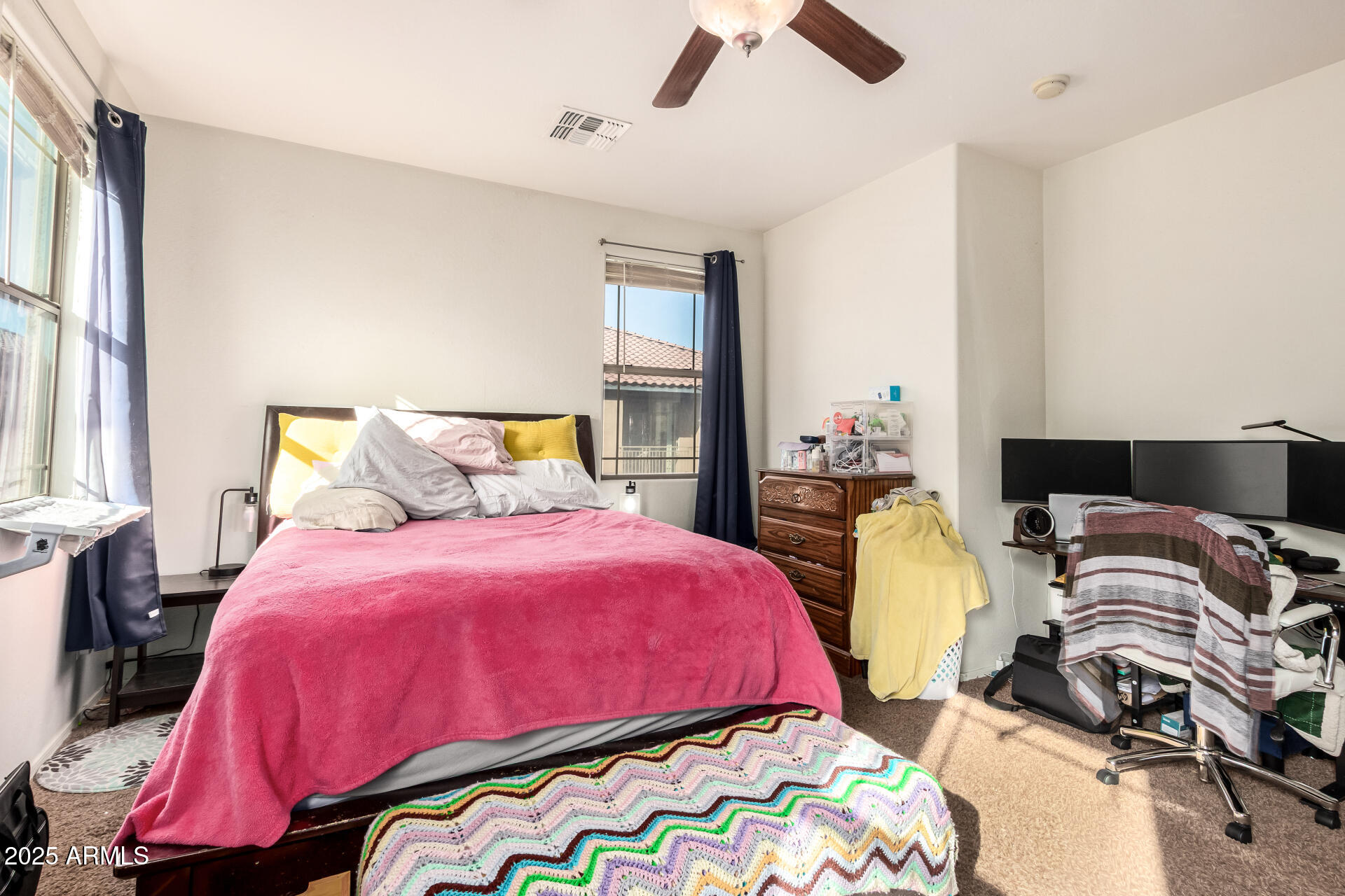 8117 West Groom Creek Road Phoenix, AZ 85043 - Photo 22 of 33 a bedroom with bed and two windows