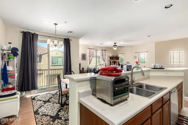 a kitchen that has a sink and a stove in it