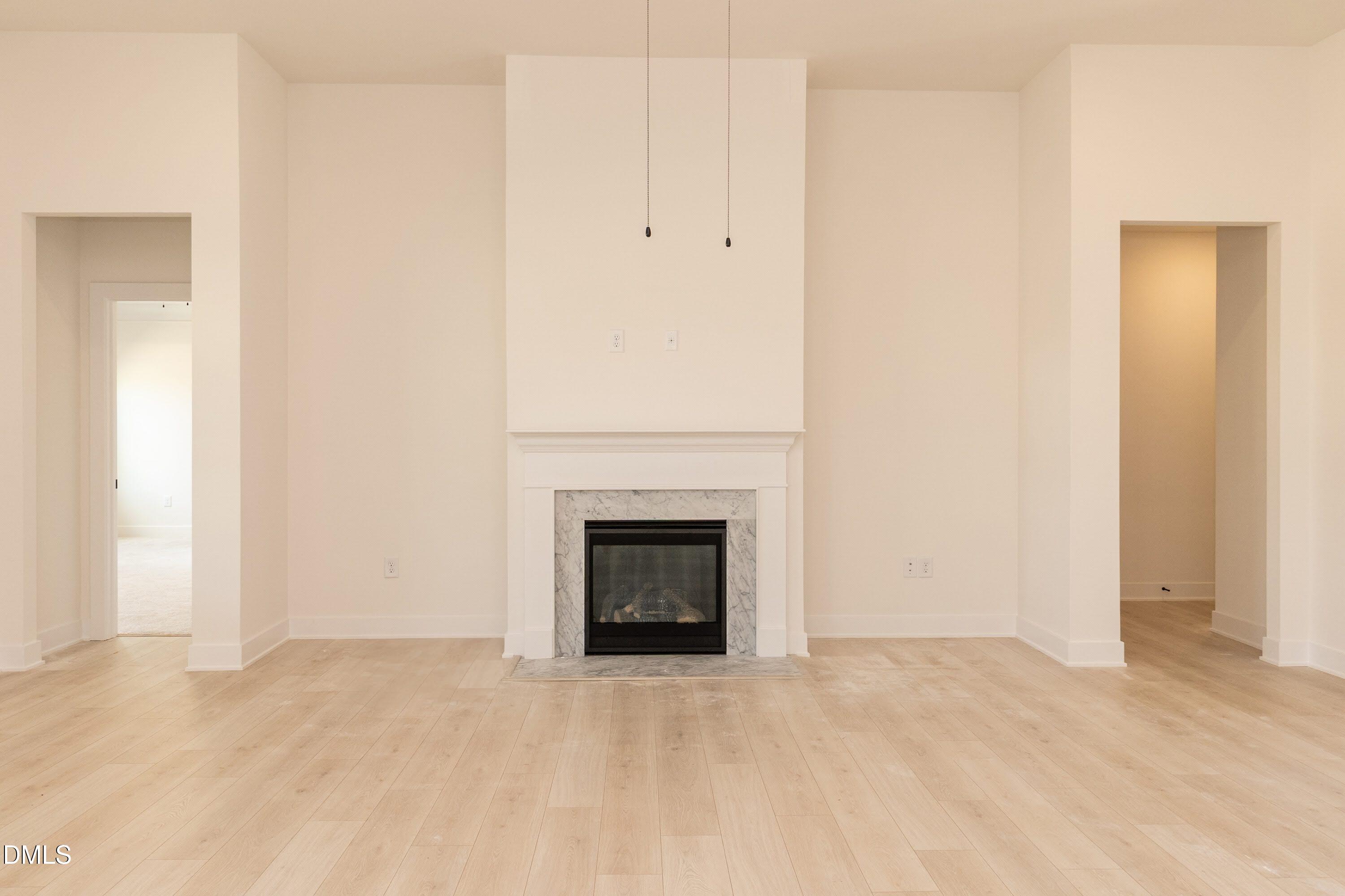 180 Galway Road Lillington, NC 27546 - Photo 19 of 41 a view of empty room with a fireplace