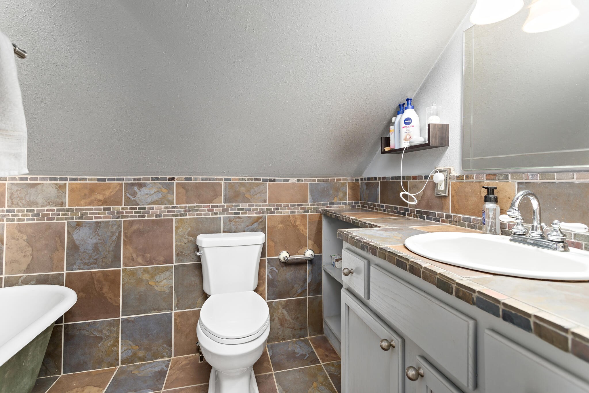 7230 Bythewood Road Beaumont, TX 77713 - Photo 30 of 35 a bathroom with a toilet sink and mirror