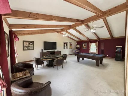 a bedroom with a bed couch and a window