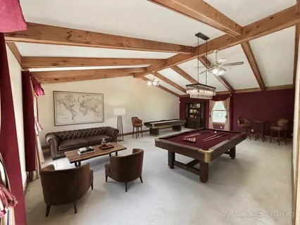 a bedroom with a bed a flat screen tv and a mirror