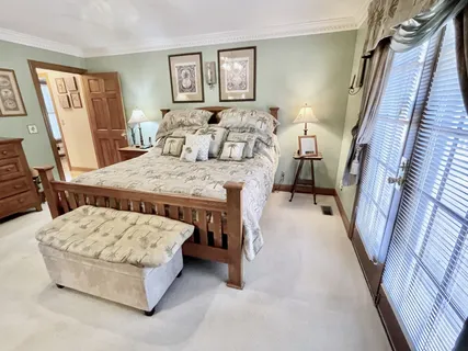 a view of lake from yard and mountain in the back