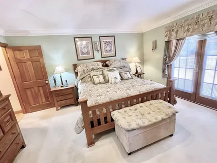 a view of a swimming pool with a lounge chair