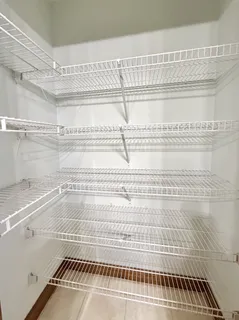 a bedroom with a bed and a table in it