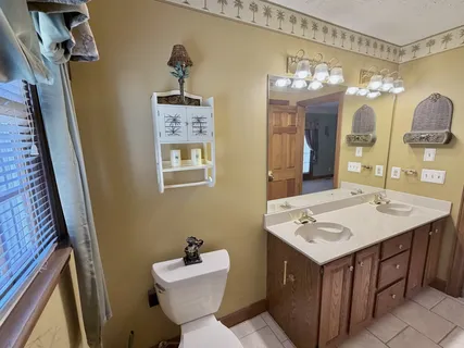 a bathroom with a toilet sink and shower