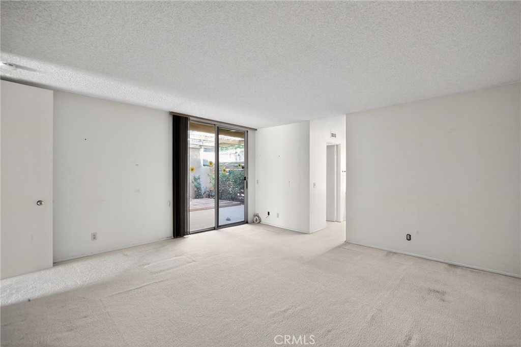 76695 Roadrunner Drive Indian Wells, CA 92210 - Photo 15 of 29 a view of an empty room with glass door