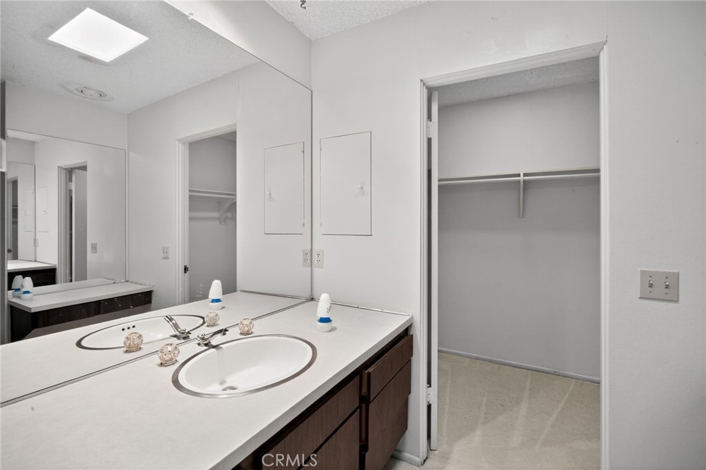 76695 Roadrunner Drive Indian Wells, CA 92210 - Photo 16 of 29 a bathroom with a sink double vanity and a mirror