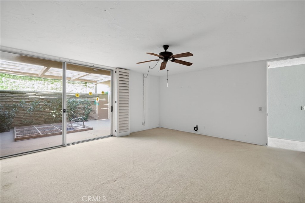 76695 Roadrunner Drive Indian Wells, CA 92210 - Photo 18 of 29 wooden floor in an empty room with a window