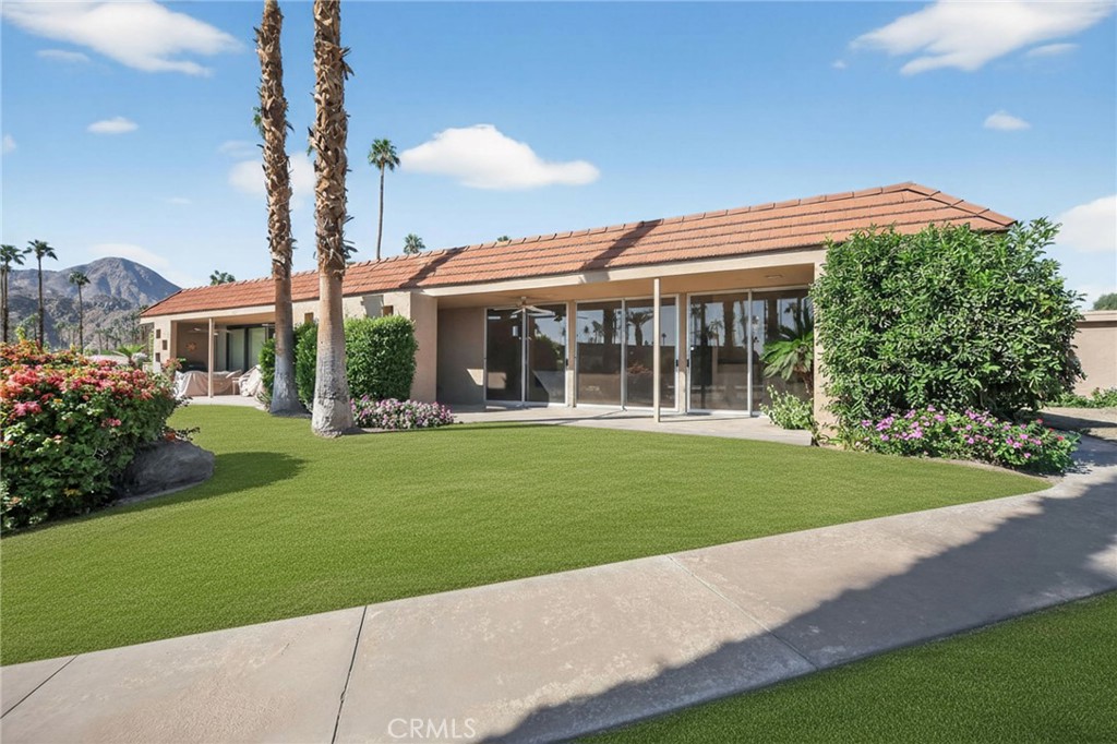 76695 Roadrunner Drive Indian Wells, CA 92210 - Photo 25 of 29 a view of a house with a garden