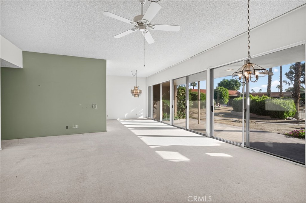 76695 Roadrunner Drive Indian Wells, CA 92210 - Photo 7 of 29 a view of an empty room with a floor to ceiling window