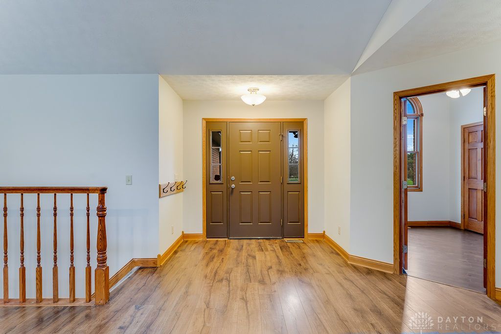7400 Cook-Jones Road Waynesville, OH 45068 - Photo 17 of 72 The bright entry features warm wood flooring, guiding you into this inviting home.