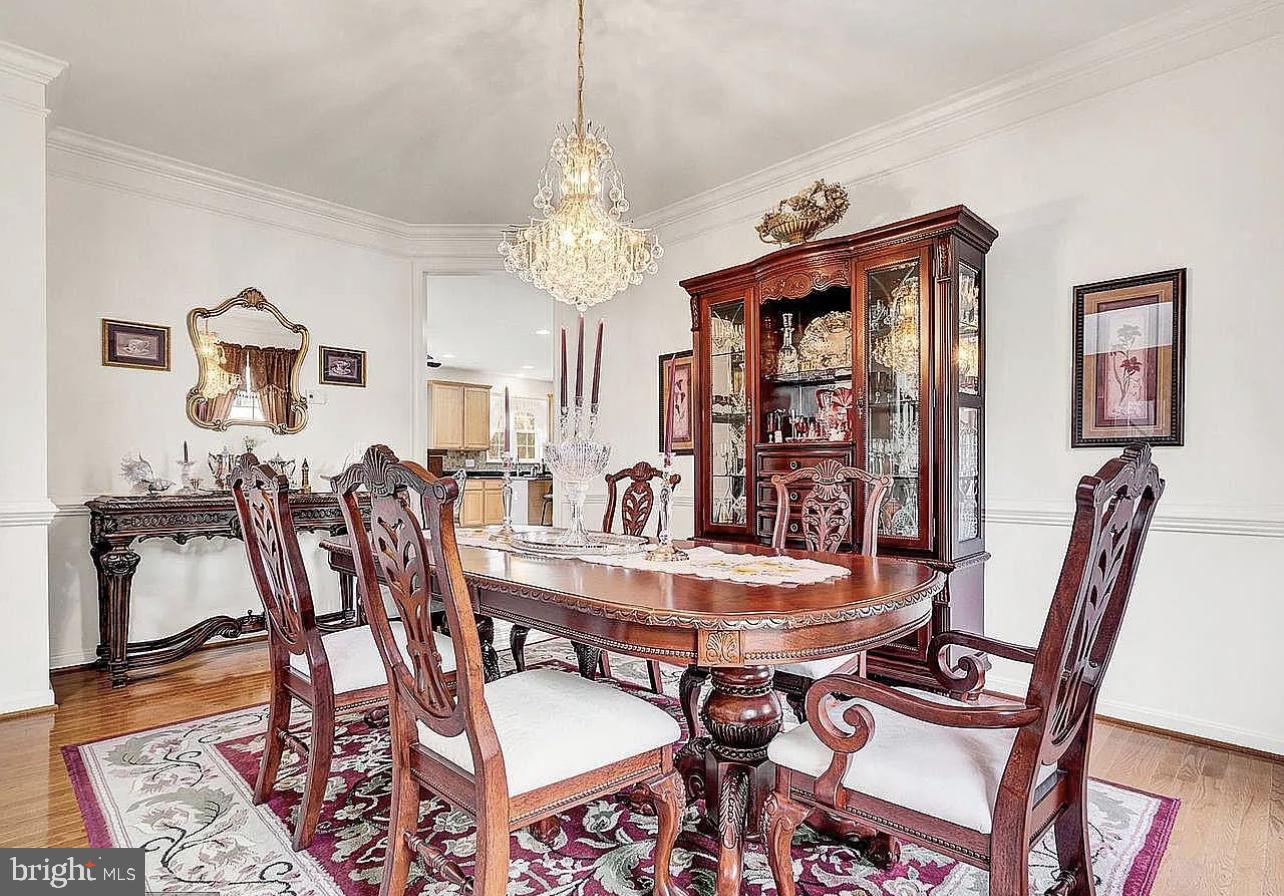 842 Kingsbrook Road Culpeper, VA 22701 - Photo 11 of 24 a view of a dining room with furniture window and wooden floor