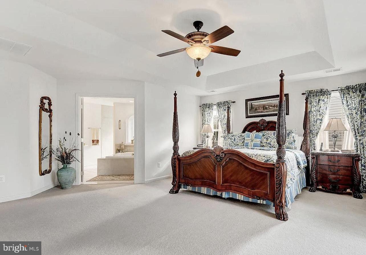 842 Kingsbrook Road Culpeper, VA 22701 - Photo 12 of 24 a bed room with a bed and a ceiling fan