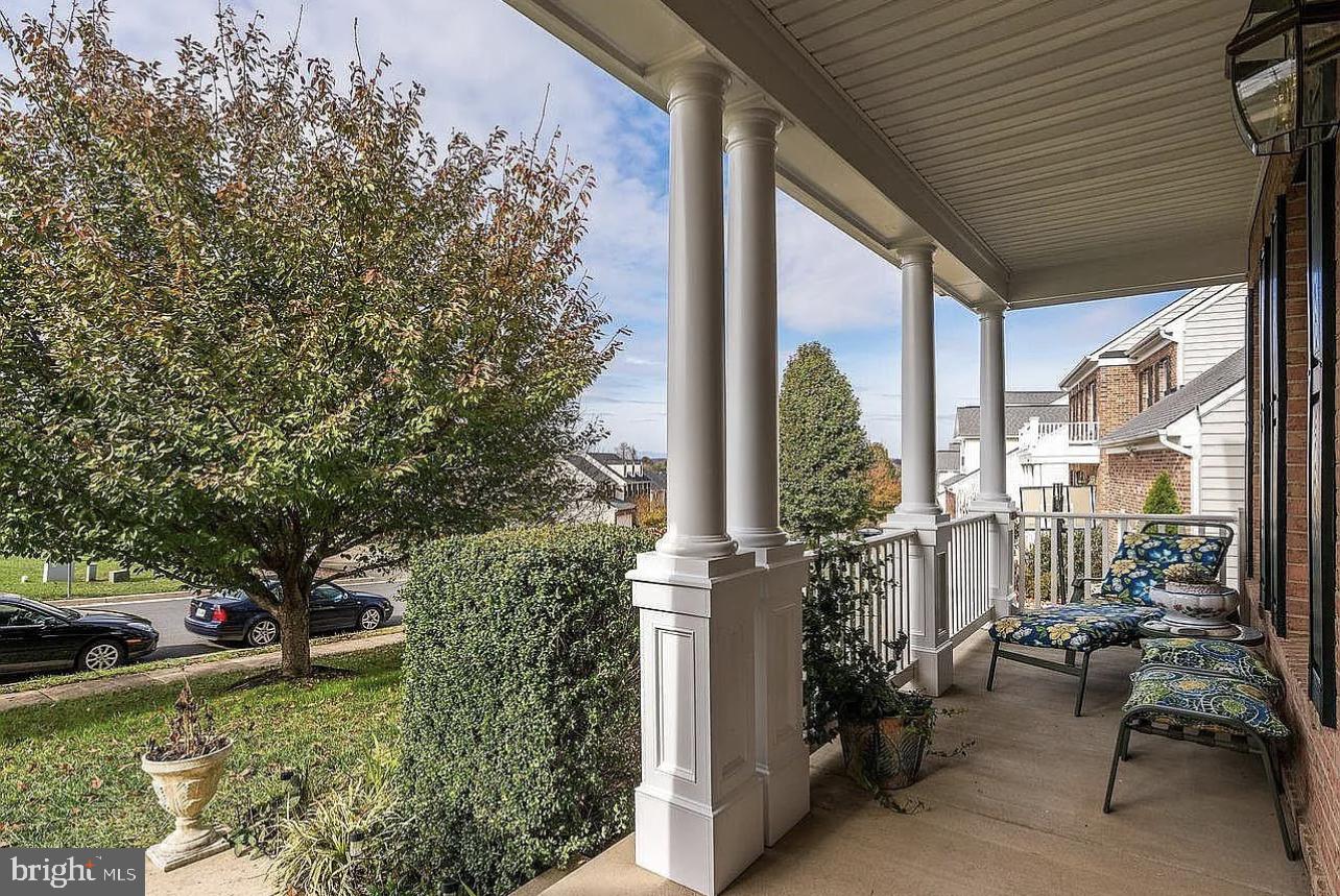 842 Kingsbrook Road Culpeper, VA 22701 - Photo 2 of 24 a view of a porch with furniture and garden