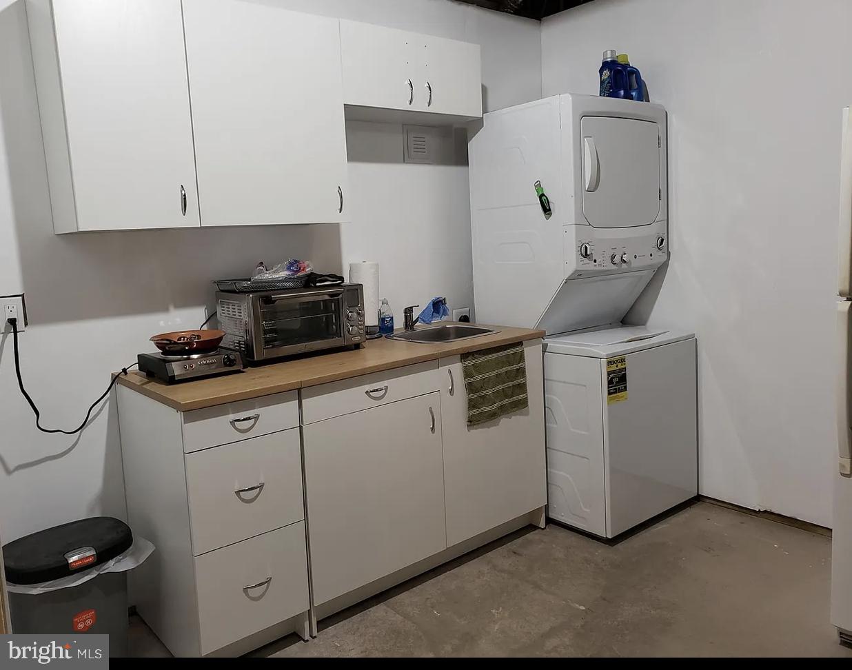 842 Kingsbrook Road Culpeper, VA 22701 - Photo 22 of 24 a view of cabinets a sink and a stove sitting inside of a kitchen