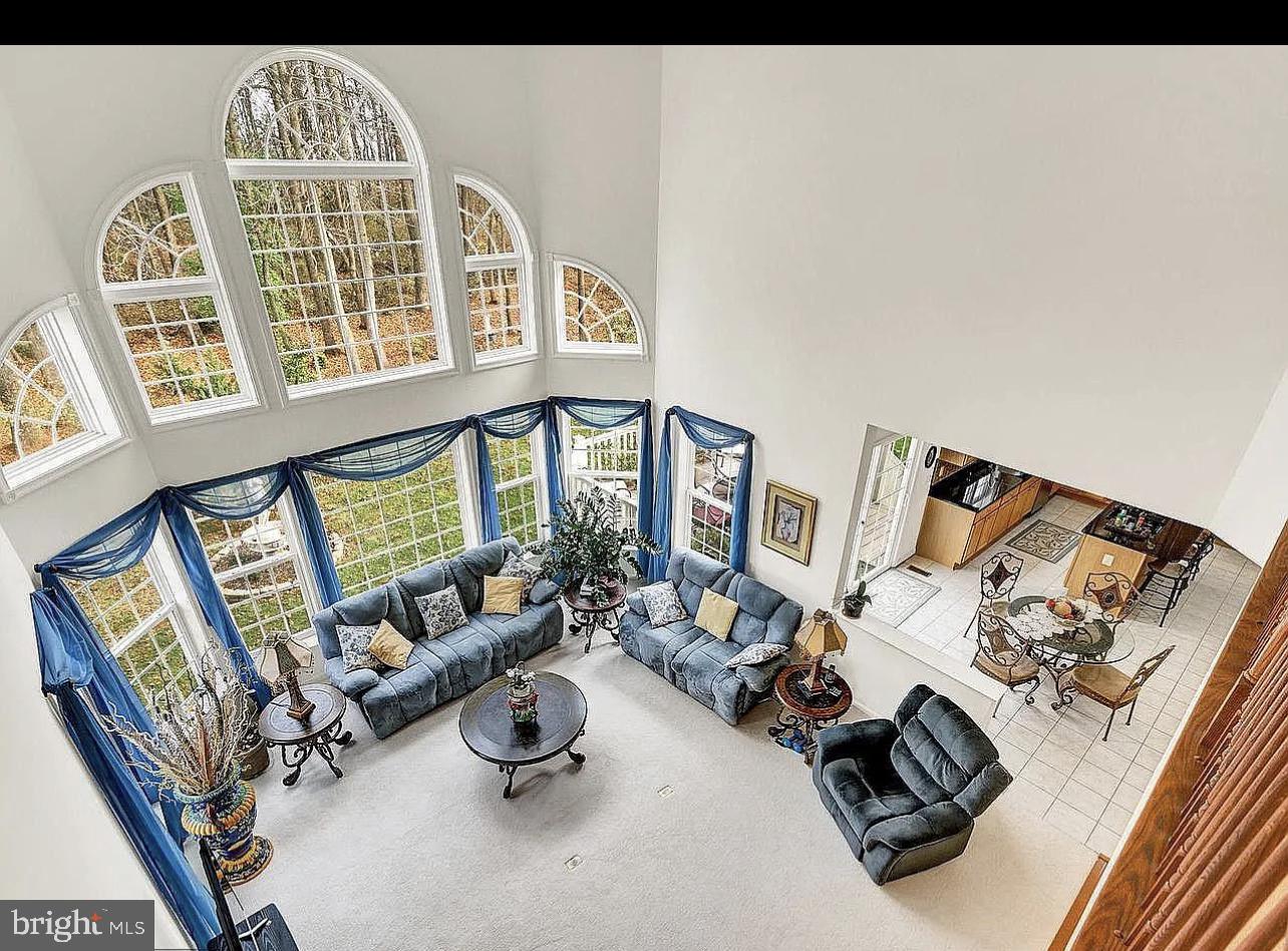842 Kingsbrook Road Culpeper, VA 22701 - Photo 5 of 24 a living room with furniture and a floor to ceiling window