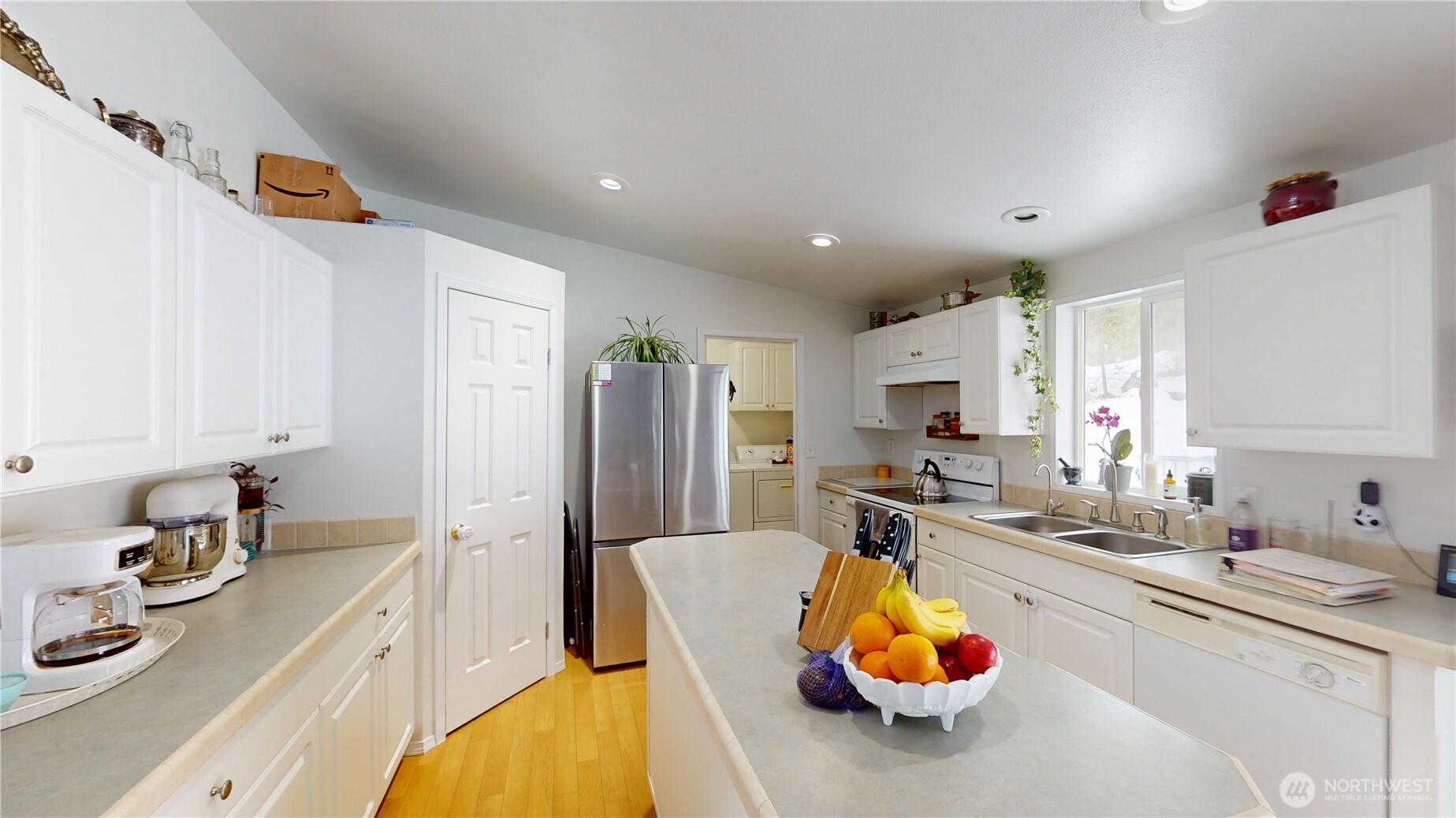 722 Aeneas Valley Road Tonasket, WA 98855 - Photo 12 of 35 a kitchen with stainless steel appliances granite countertop a sink refrigerator and cabinets