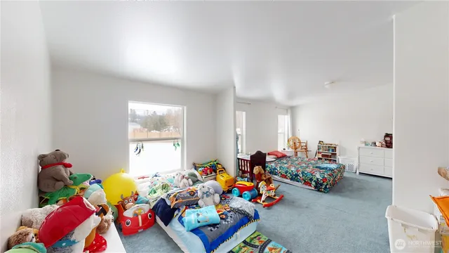 a bed room with lots of baby toys