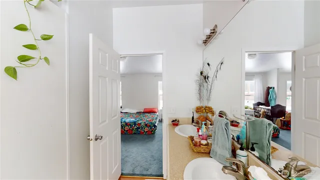 a bed room with a bed and a television