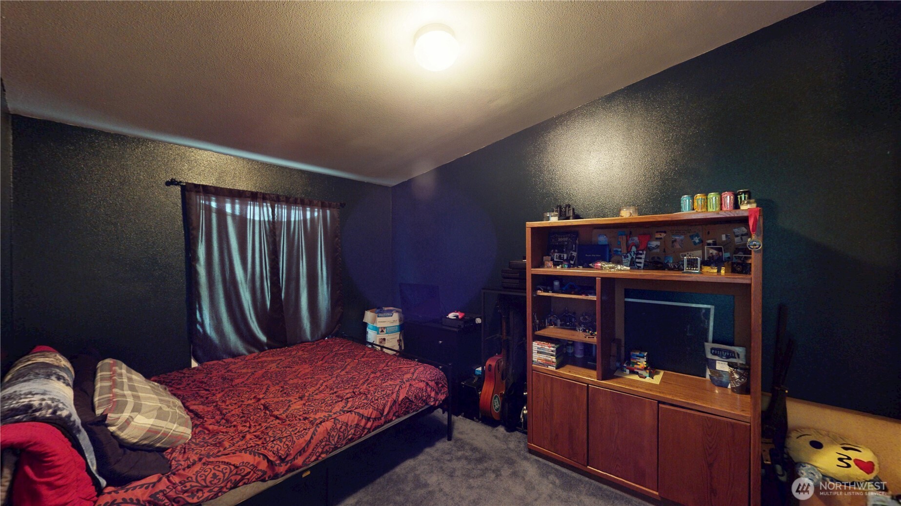 722 Aeneas Valley Road Tonasket, WA 98855 - Photo 21 of 35 a bed room with a bed and a television