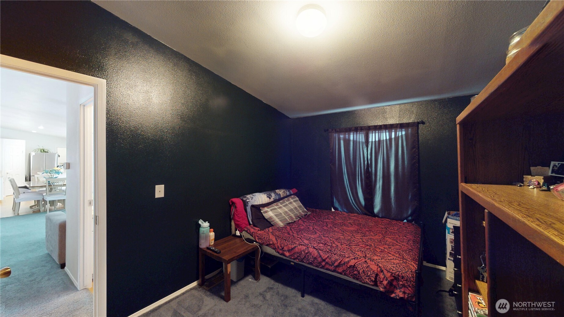722 Aeneas Valley Road Tonasket, WA 98855 - Photo 22 of 35 a bedroom with a bed and a dresser