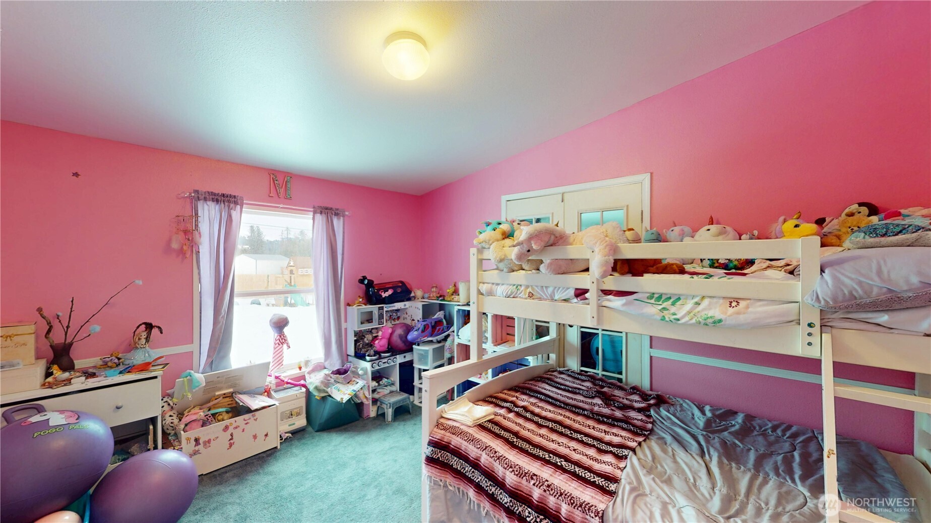 722 Aeneas Valley Road Tonasket, WA 98855 - Photo 25 of 35 a room with furniture and a wooden floor