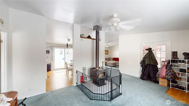 a living room with furniture a air conditioner vent and a window