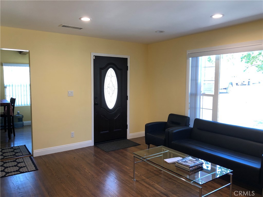 10404 Foothill Boulevard Sylmar, CA 91342 - Photo 5 of 29 a living room with furniture and a window