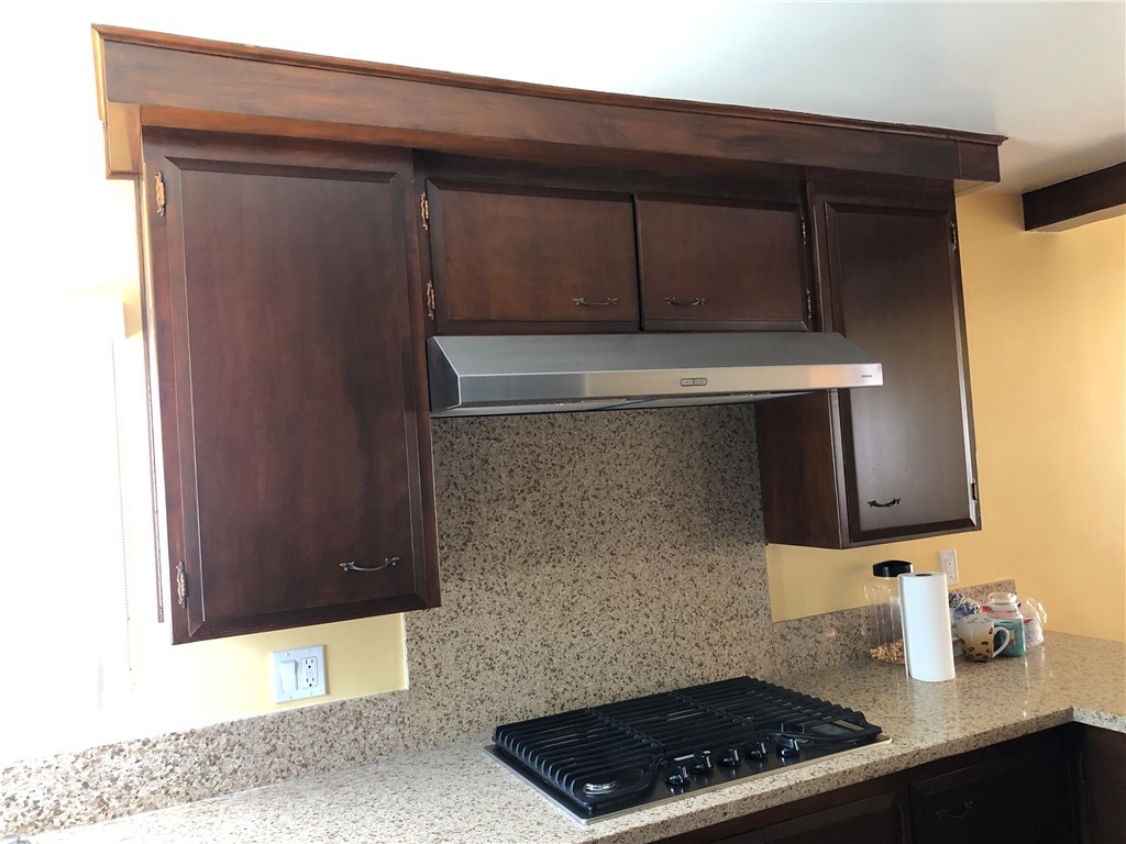 10404 Foothill Boulevard Sylmar, CA 91342 - Photo 8 of 29 a kitchen with a sink and cabinets