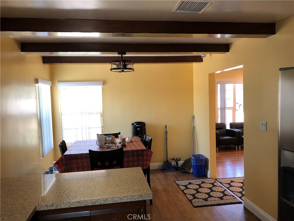 10404 Foothill Boulevard Sylmar, CA 91342 - Photo 9 of 29 a living room with furniture and a window